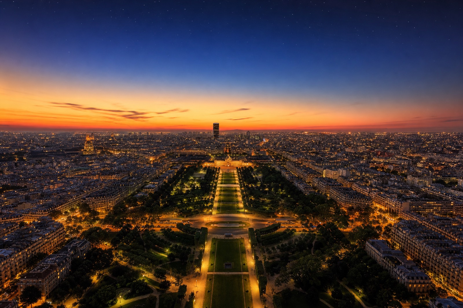 View down the Champ-de-Mars gardens toward the École Militaire at sunset